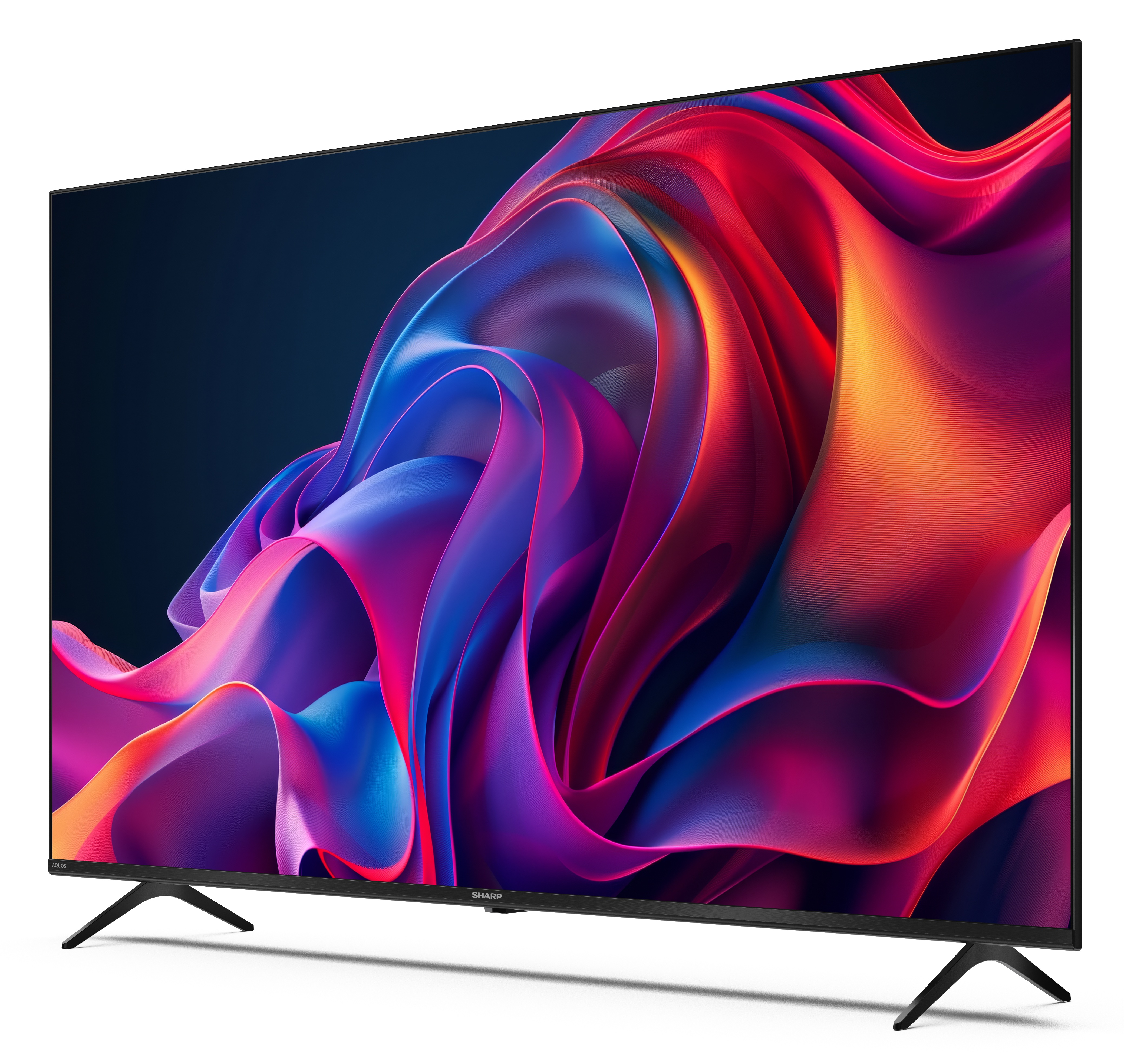 Telewizor Sharp wyświetla kolorowy, abstrakcyjny obraz. Telewizor jest czarny, pochylony, z czarnymi nogami, na białym tle.