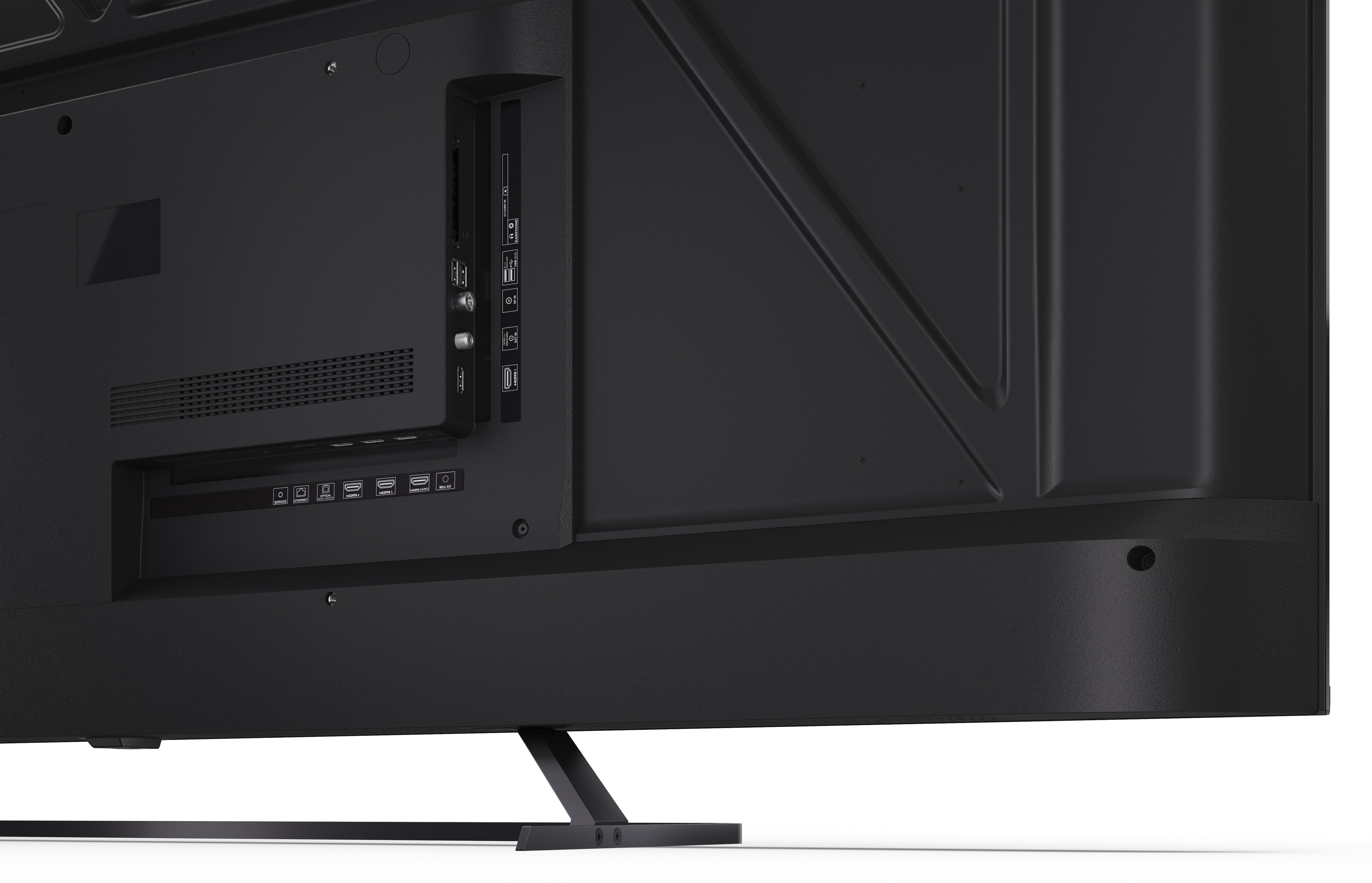 Widok z tyłu czarnego telewizora. Widoczne porty i połączenia. Metalowa podstawa na białej powierzchni.