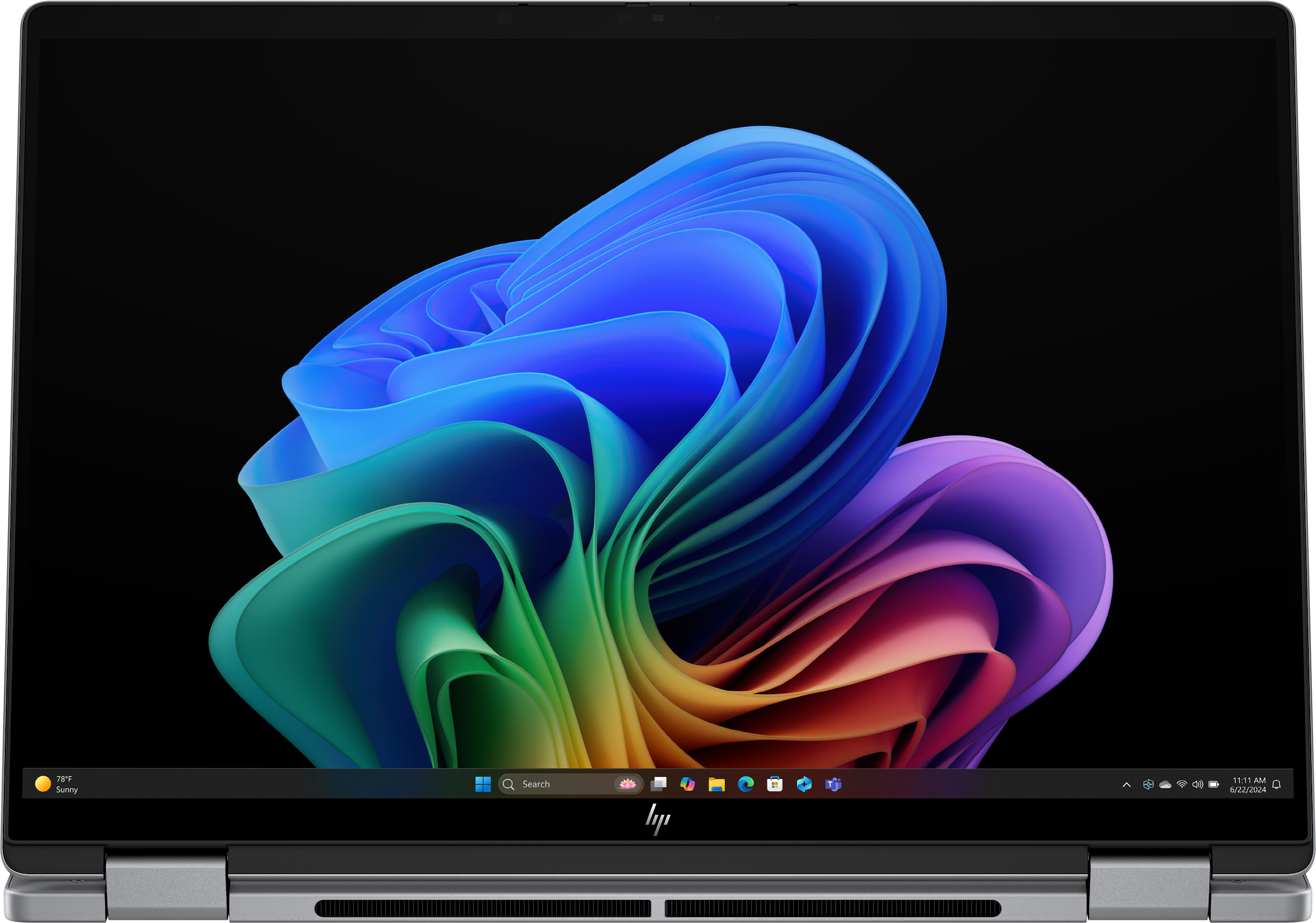 Lo schermo del laptop mostra un design floreale astratto colorato su sfondo nero. Barra delle applicazioni inferiore con icone.