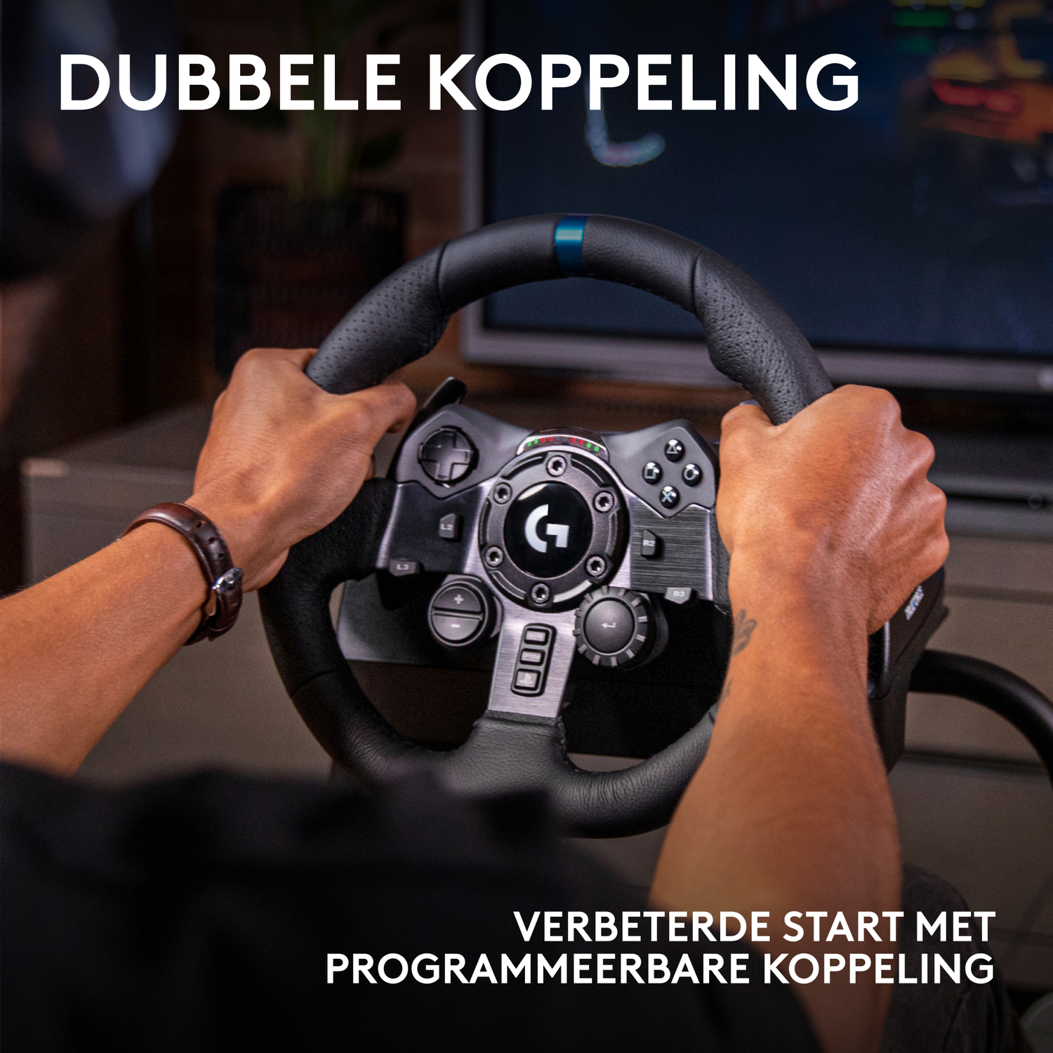Hands holding a black steering wheel with buttons. The wheel is centered, with a screen in the background. Text at the top and bottom.