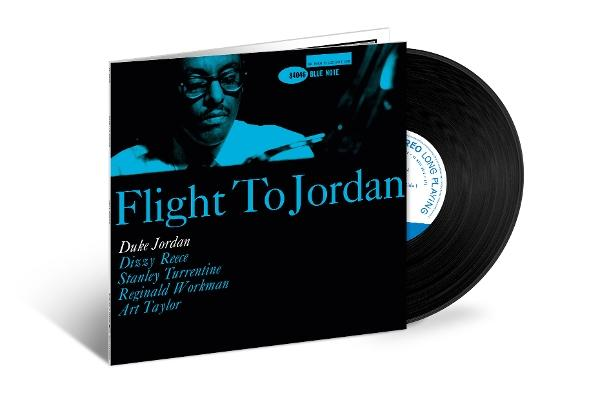 Albumcover für "Flight to Jordan". Es zeigt ein schwarzes Cover mit einem blauen Bild eines Mannes und dem Albumtitel. Daneben eine Schallplatte.