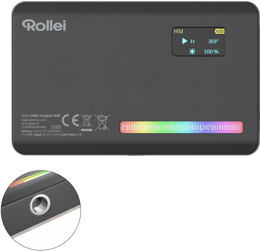 Ein schwarzes Rollei Lumis Compact RGB Licht. Es hat ein Display mit Einstellungen. Der Boden hat einen Farbspektrum-Balken.
