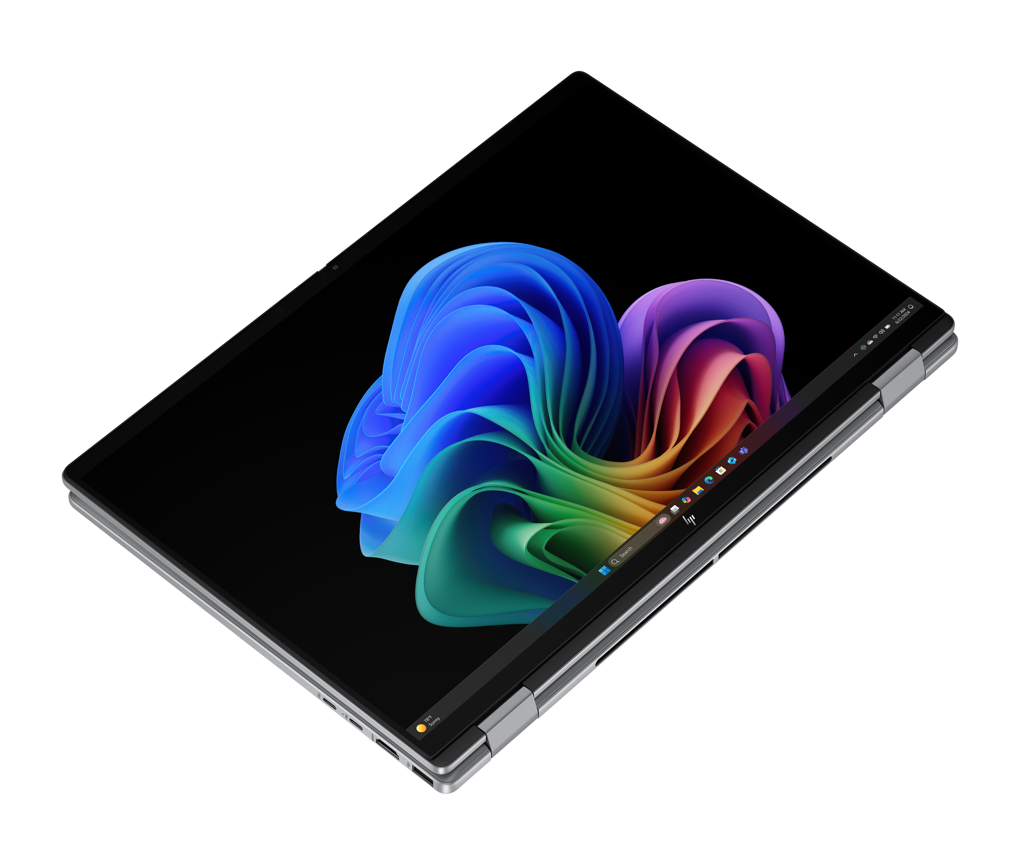 Laptop z kolorowym, abstrakcyjnym obrazem na ekranie. Laptop jest srebrny i czarny.