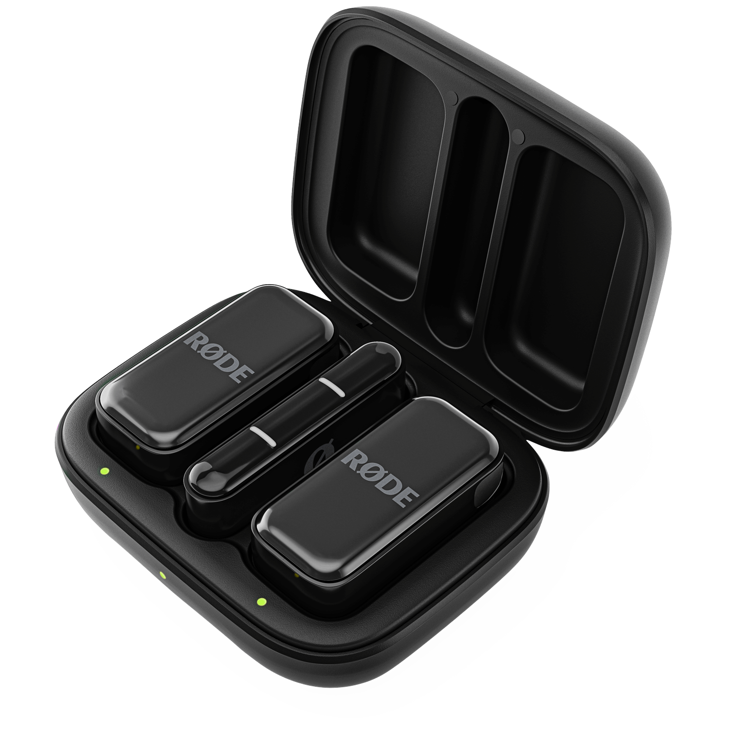 Black Rode wireless microphone charging case, open. Two microphones and a receiver are inside. Green lights indicate charging status.