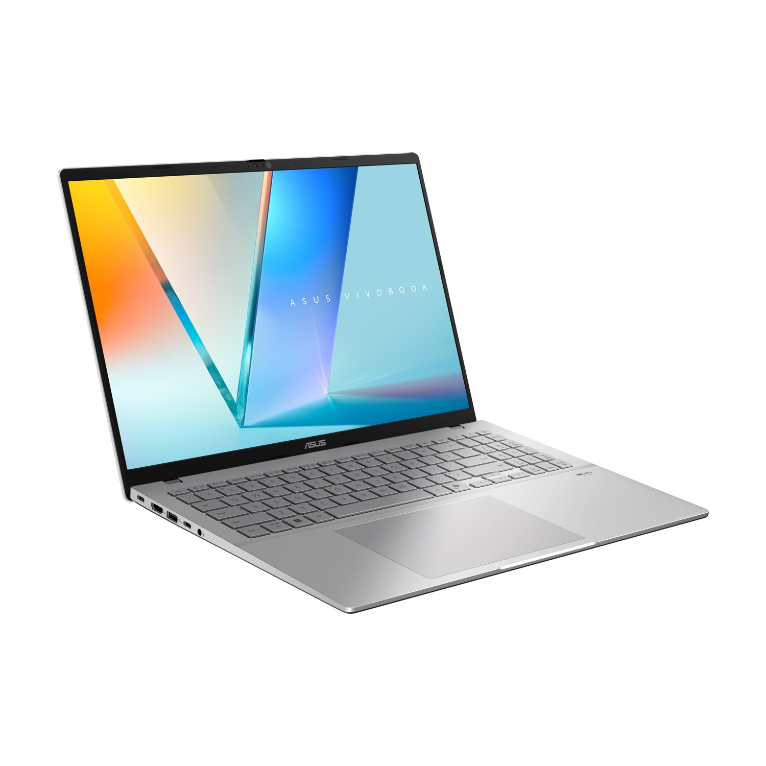 Un laptop ASUS Vivobook argentato è aperto su sfondo bianco. Lo schermo mostra una grafica colorata. Tastiera visibile.