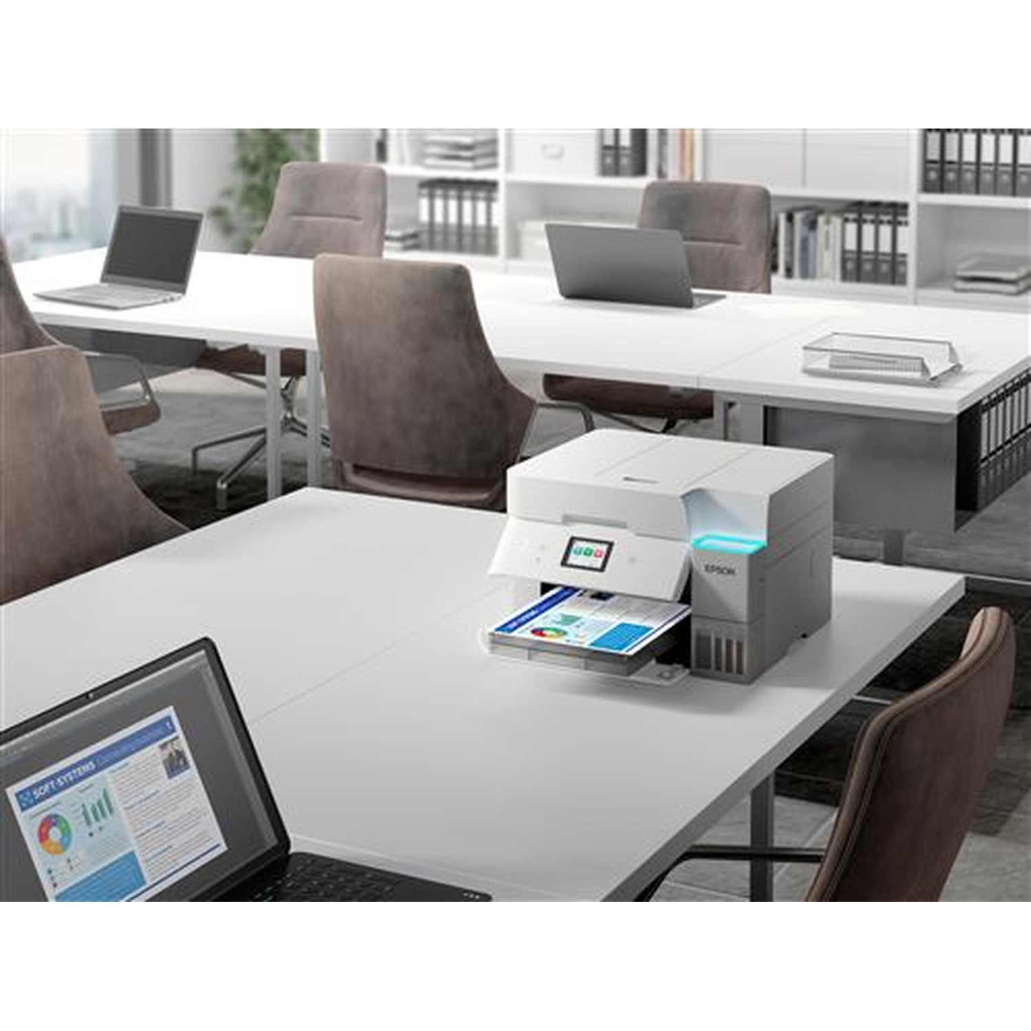 An office scene with a printer printing. Laptops and chairs are around white desks. Shelves filled with files are in the background.