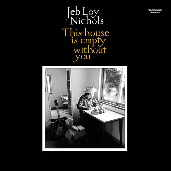 Albumcover: Mann mit Hut sitzt am Fenster, Text lautet "This house is empty without you". Gitarre und Kisten im Vordergrund.
