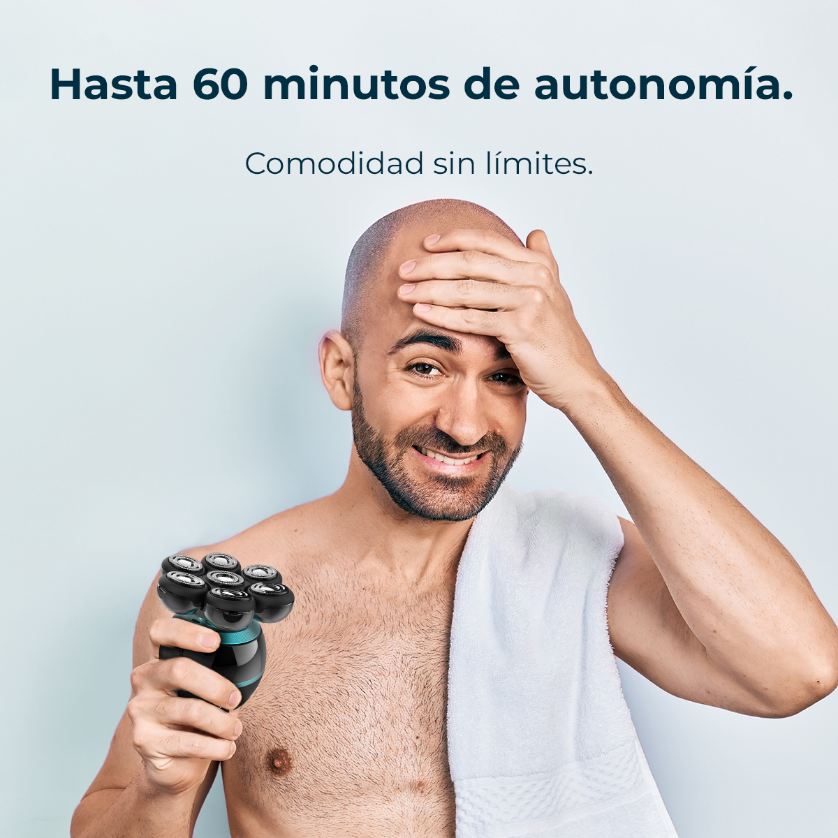 Hombre con afeitadora, toca su frente, toalla en hombro. Texto: Hasta 60 minutos de autonomía. Comodidad sin límites.