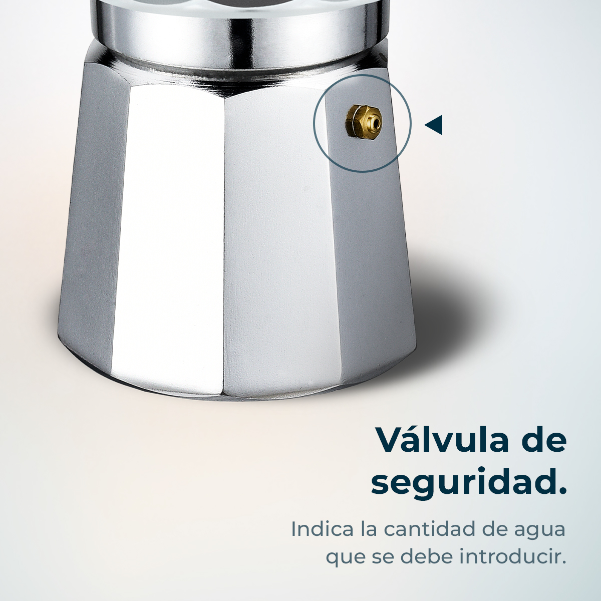 Una cafetera plateada con una válvula de seguridad. Un triángulo azul oscuro apunta a la válvula. El texto debajo dice: válvula de seguridad.