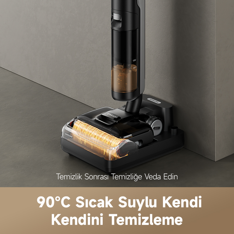 Siyah ve şeffaf bir elektrikli süpürge gri bir zeminde duruyor. Aşağıdaki metin '90°C Sıcak Su ile Kendi Kendini Temizleme' diyor.