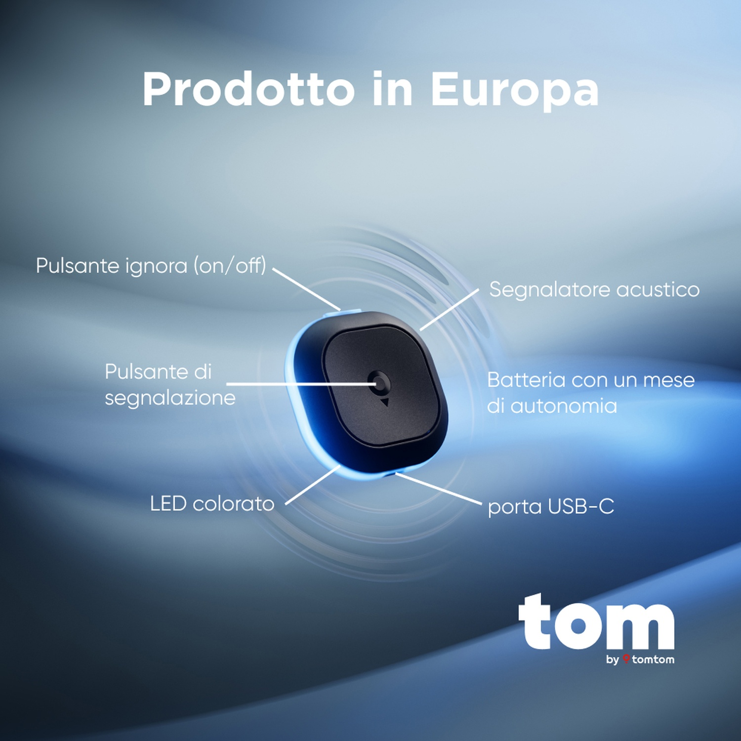 Un dispositivo nero e arrotondato con etichette che indicano le sue funzioni, tra cui un pulsante, LED e porta USB-C. Il marchio 'tom' è visibile.