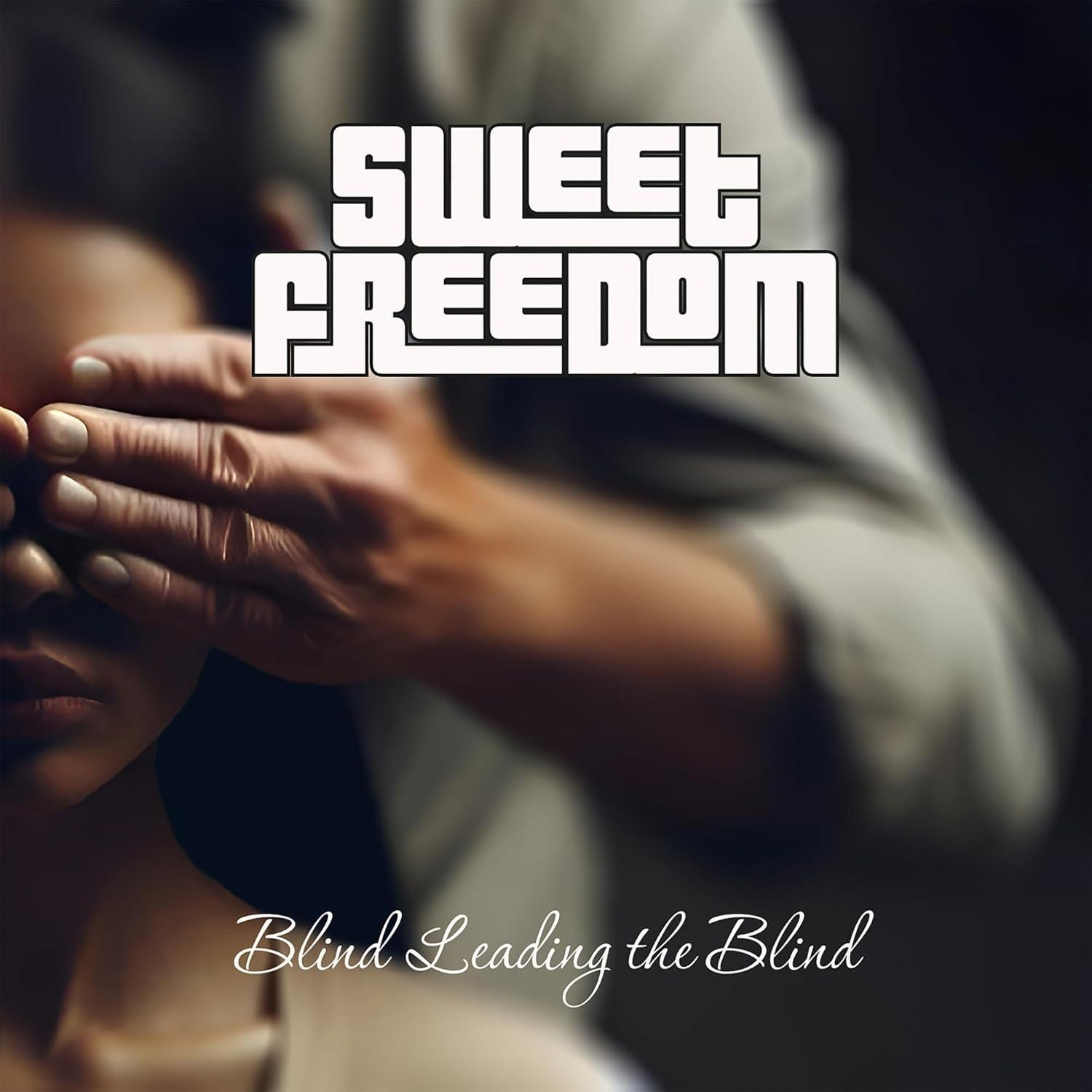 Eine Hand bedeckt die Augen einer Person. Text: Sweet Freedom, Blind Leading the Blind. Weicher Hintergrund.