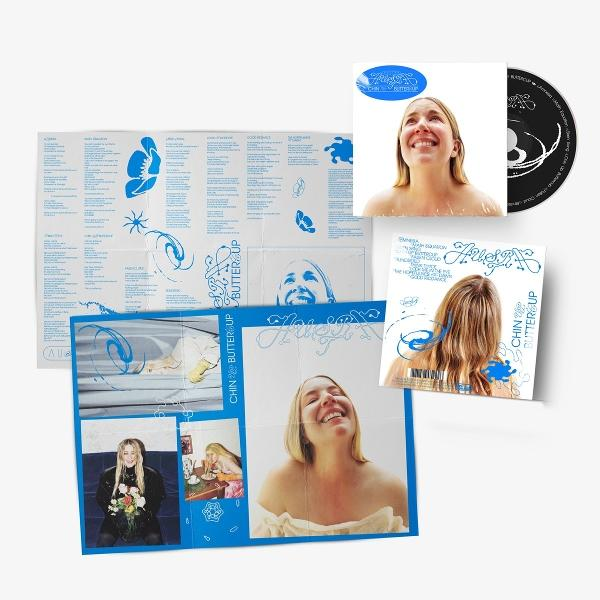 Albumcover: Lachende Frau, CD, Poster mit Text und Bildern, blaues und weißes Farbschema, Albumtitel 'Chin Buttercup'.