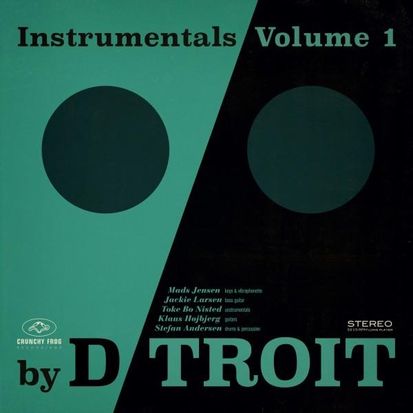 Albumcover. Titel: Instrumentals Volume 1. Diagonal geteilt. Türkis und schwarzer Hintergrund. Zwei dunkle Kreise. Text: D Troit von Crunchy Frog.