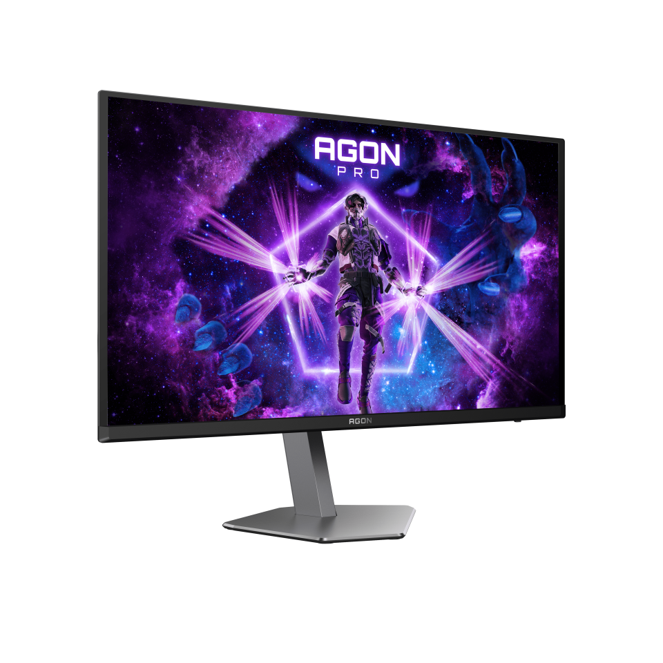 Az AGon Pro monitor egy kozmikus jelenetet jelenít meg, egy páncélos figurával. A monitor ezüst állvánnyal rendelkezik. A lila és kék tónusok dominálnak.