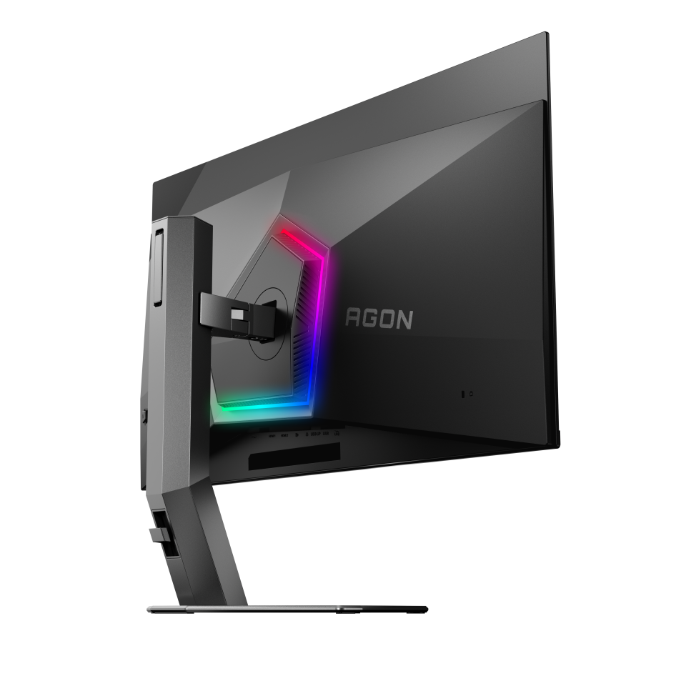 Egy fekete Agon gamer monitor, a hátuljának oldalsó nézete. Színes LED-fényei vannak. A tartó a bal oldalon van.