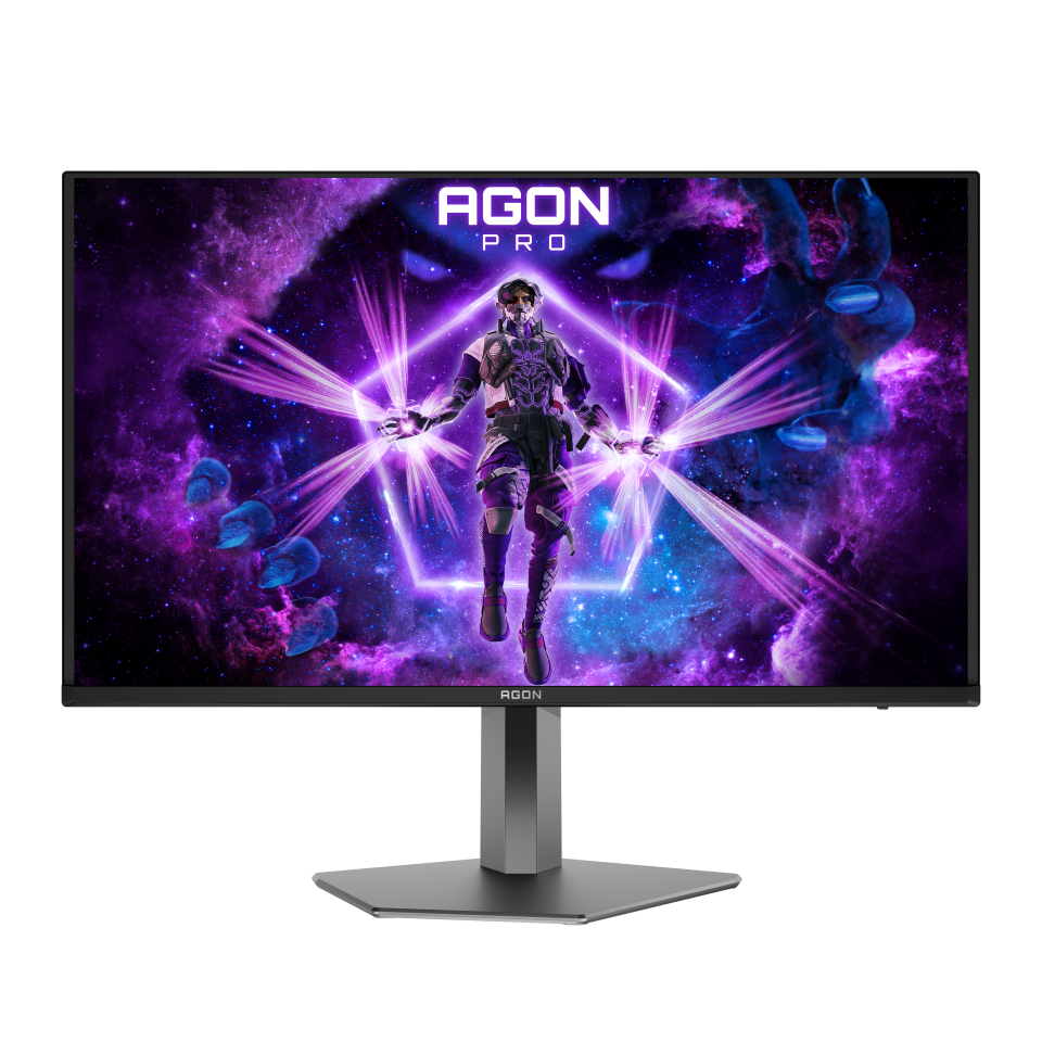 Az AGON PRO monitor egy digitális karaktert jelenít meg energiasugarakkal. A háttér egy lila és kék tónusú ködöt mutat.