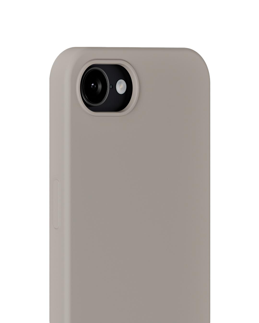Nahaufnahme einer Smartphone-Hülle in neutraler Beige-Farbe. Kameraobjektiv und Blitz sind oben sichtbar.
