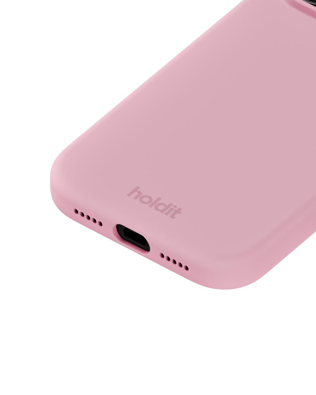 Nahaufnahme einer rosa Handyhülle mit dem Markennamen 'holdit'. Die Hülle hat einen Anschluss und Lautsprecherlöcher. Der Hintergrund ist weiß.