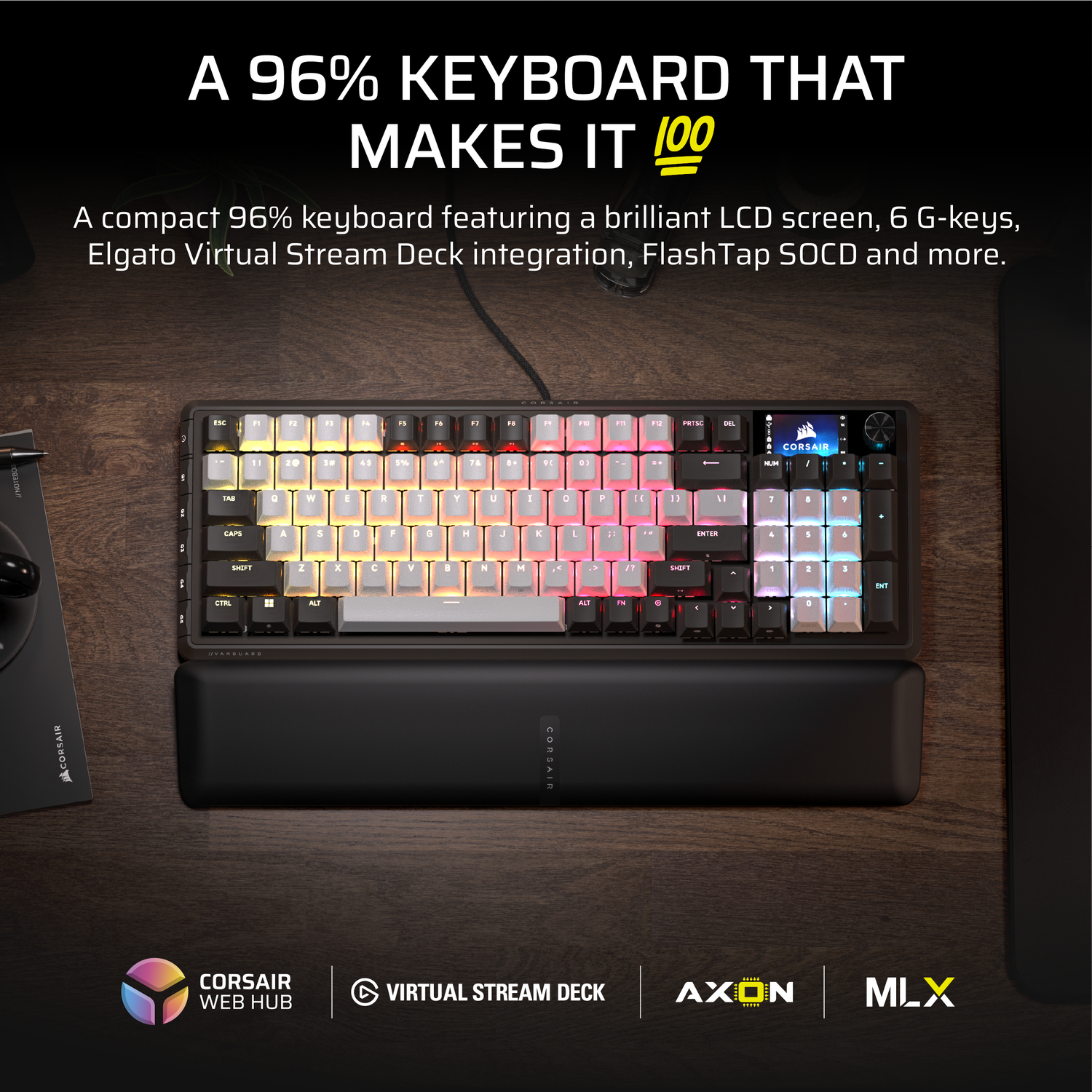 A black Corsair keyboard with colorful lit keys, a wrist rest, and logos on a wooden surface.
