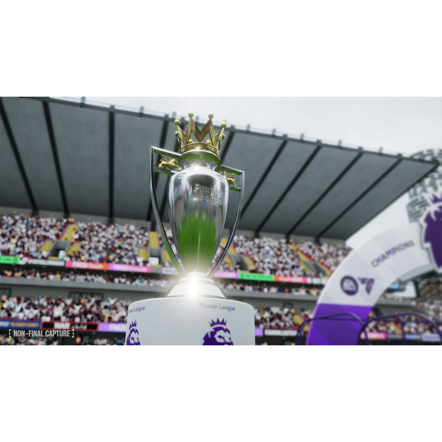 De Premier League-trofee. Een stadion op de achtergrond. De trofee is zilver met een gouden kroon en staat op een witte basis.