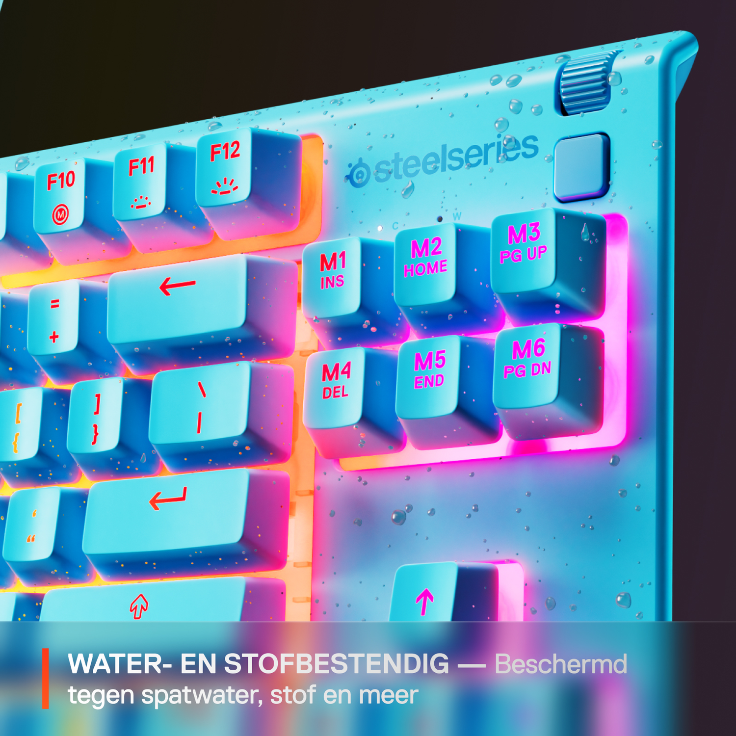 A close-up of a light blue keyboard with illuminated pink keys. Steelseries logo is visible. Water droplets are on the surface, with text at the bottom.