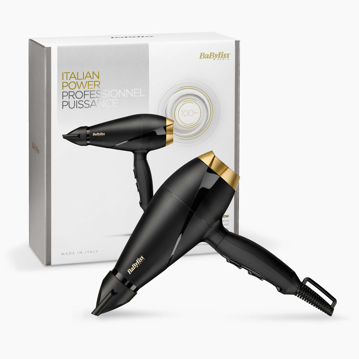 Ein schwarzer und goldener BaByliss-Haartrockner wird vor seiner Verpackung präsentiert. Die Box hat Text auf Französisch und Italienisch.