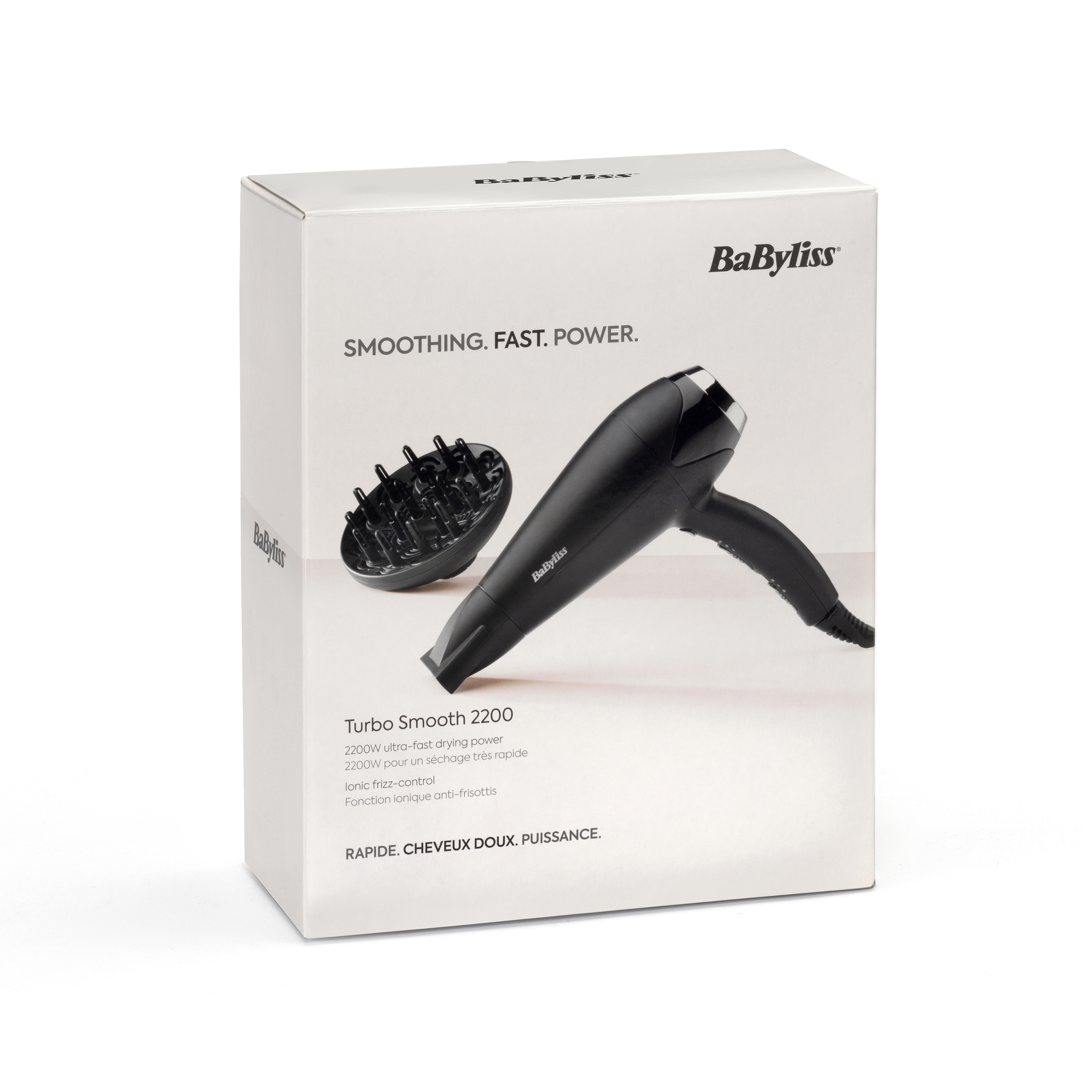 Ein weißer Karton mit einem schwarzen Haartrockner und Düse. Die Marke ist BaByliss. Text: 'glätten, schnell, kraft'.