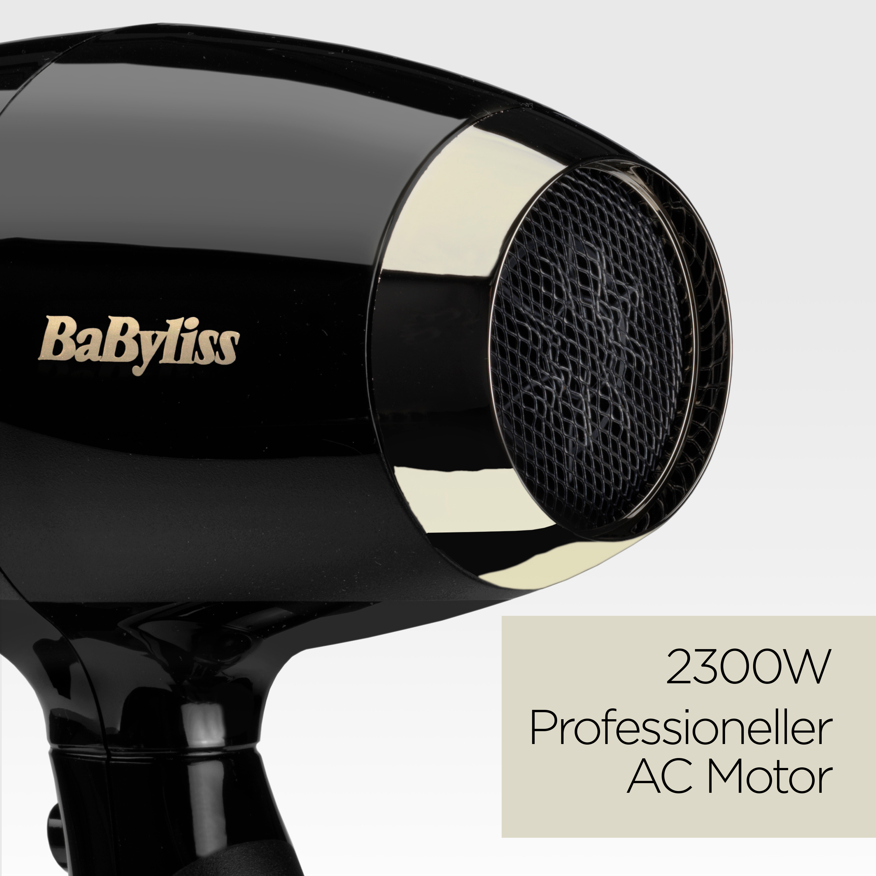 Schwarzer BaByliss-Haartrockner mit goldenem Akzent. Der Text auf der Seite lautet: '2300W Professioneller AC Motor'.