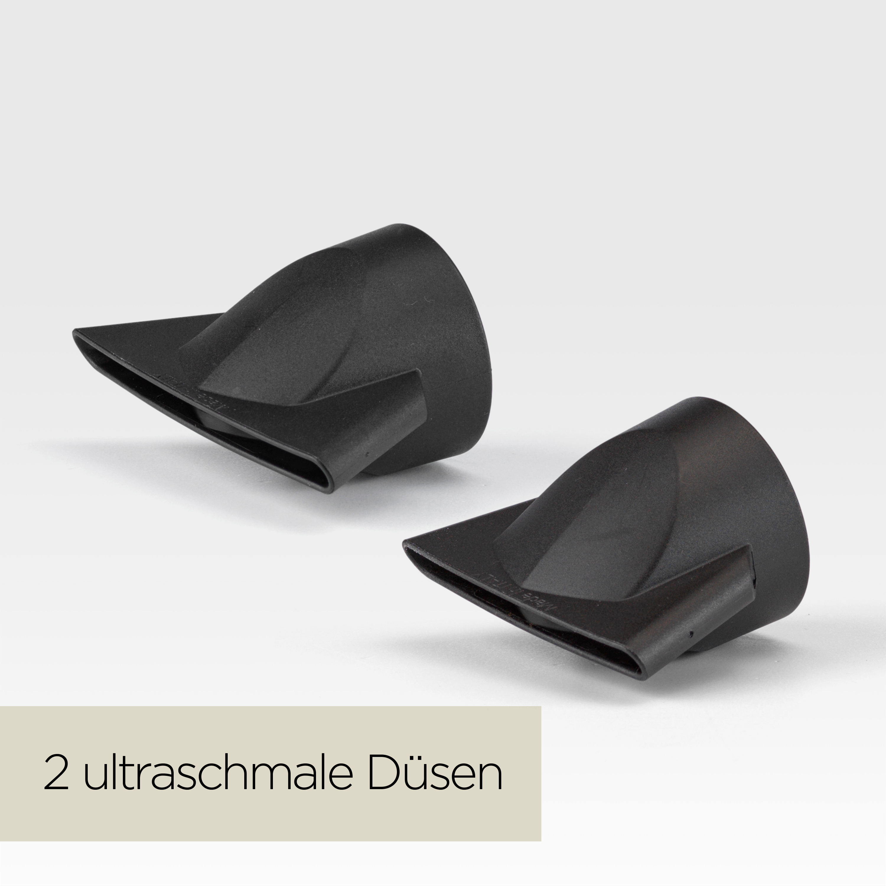 Zwei schwarze Haartrocknerdüsen auf weißem Hintergrund. Text auf Deutsch: '2 ultraschmale Düsen'.