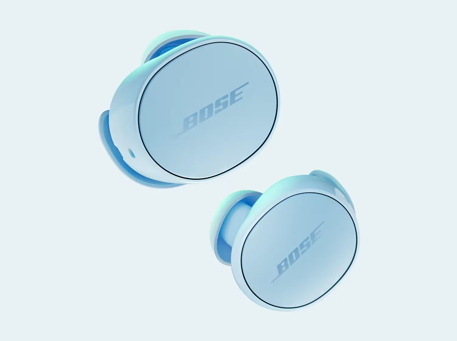 Due auricolari Bose azzurri, fluttuanti su sfondo bianco. Il logo Bose è visibile su entrambi.