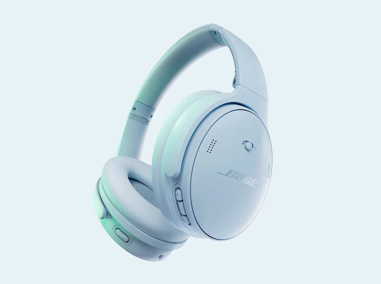 Un casque antibruit Bose bleu clair sur fond bleu clair. Le casque est mis au point. L'arrière-plan est flou.