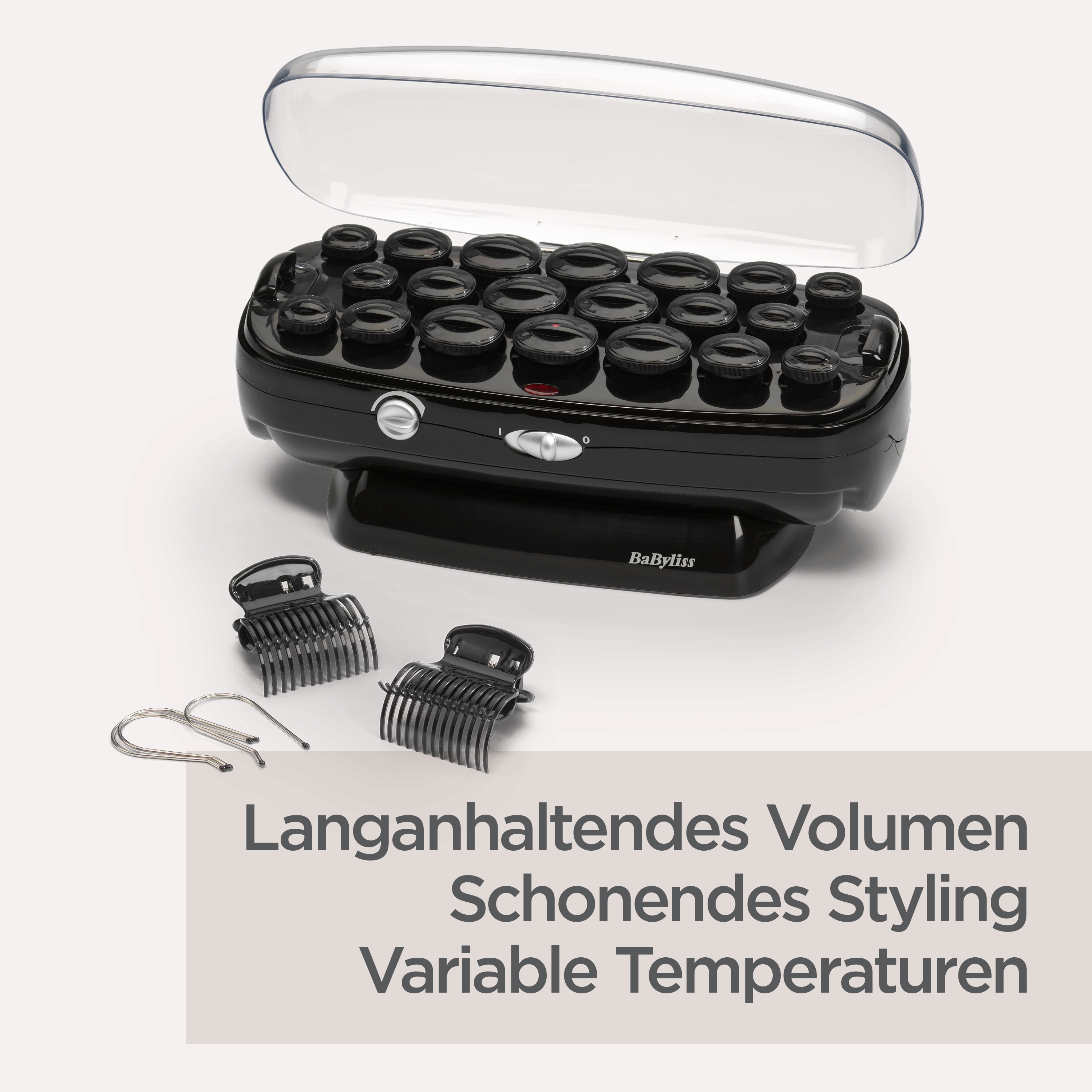 Schwarzes Lockenwickler-Set mit Clips und Haarnadeln. Das Set befindet sich auf einer weißen Oberfläche. Text im Hintergrund.