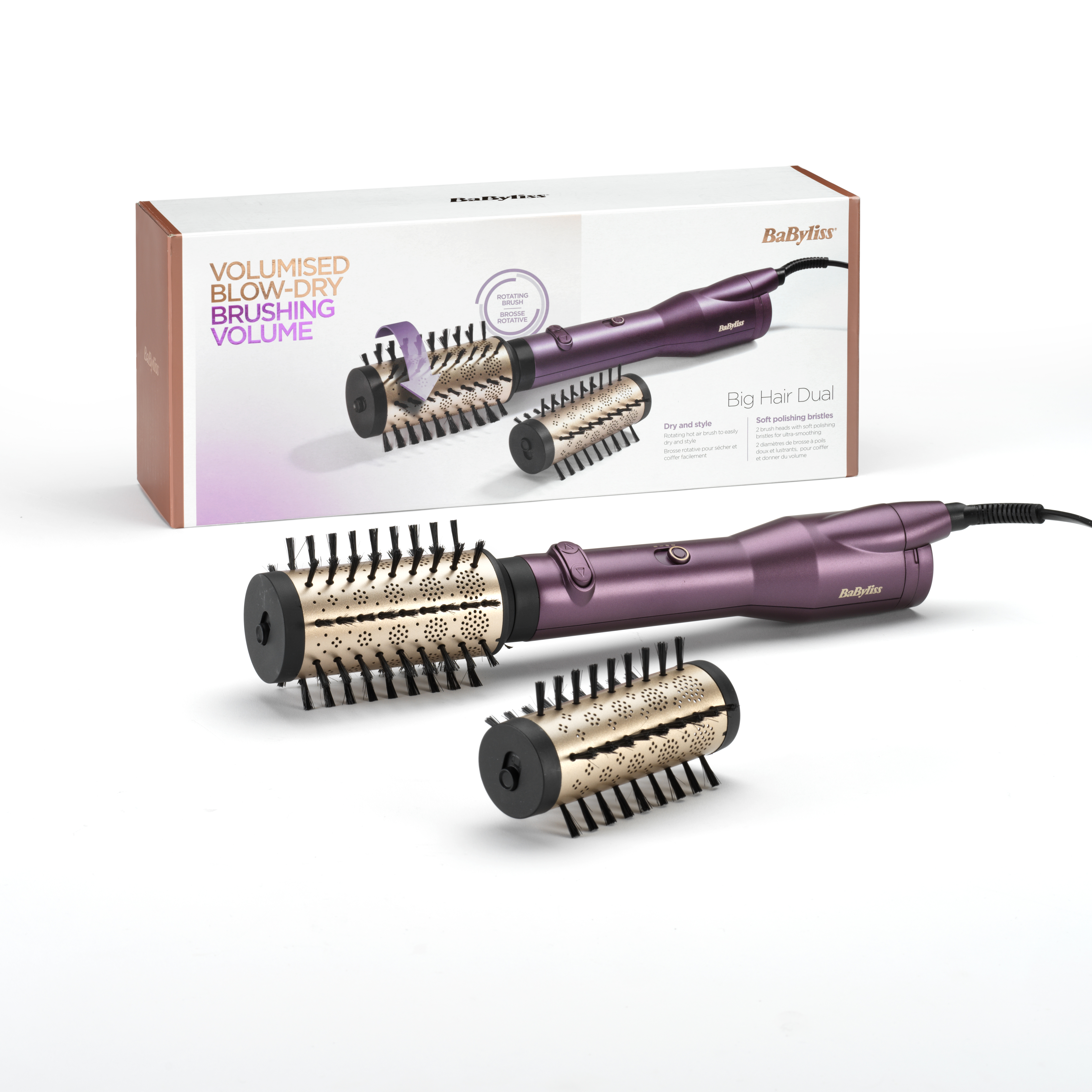 Ein BaByliss-Haarstyling-Tool mit lila Griff und zwei Bürstenköpfen sowie eine Box mit Text.