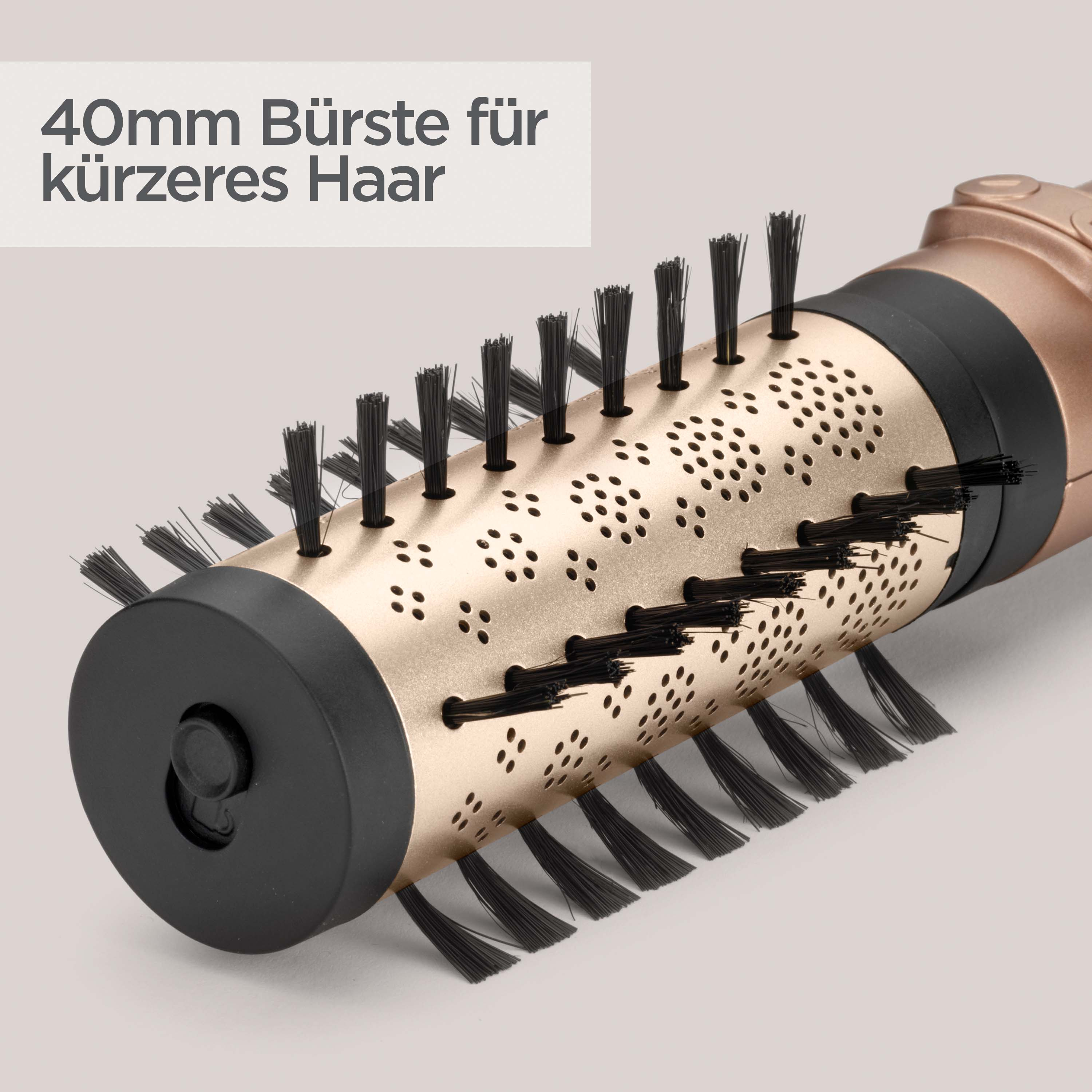 Nahaufnahme einer Haarbürste mit goldfarbenem Lauf und schwarzen Borsten. Text: 40mm Bürste für kürzeres Haar.