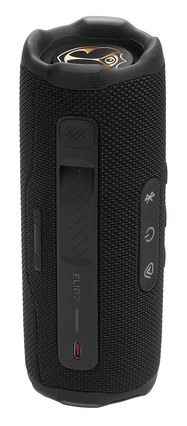 Czarny głośnik JBL Flip 7. Posiada przyciski, port ładowania i logo Flip 7. Ma siateczkową teksturę.