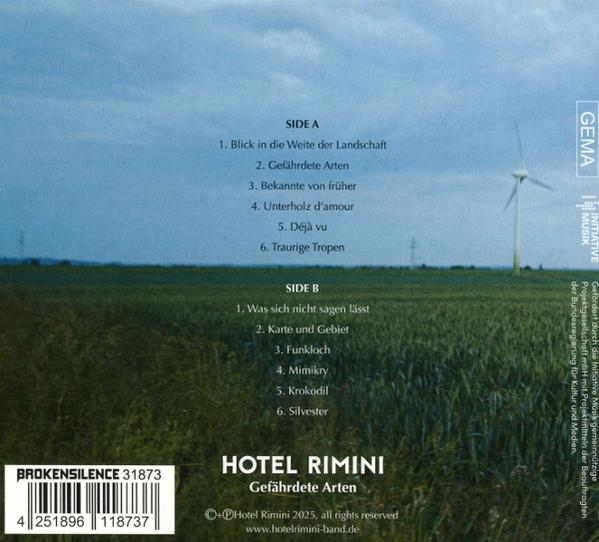 Albumcover mit Feld und Windrad. Text enthält Titelliste, Bandname und Label.