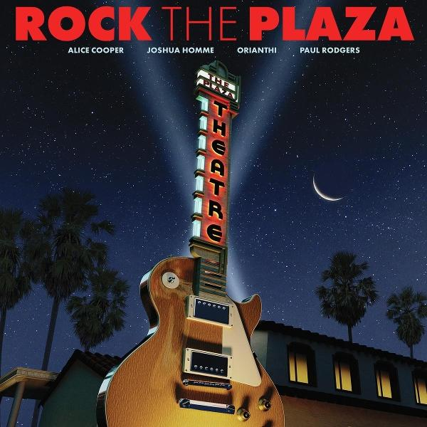 Ein gitarrenförmiges Schild für 'The Plaza Theatre' mit Nachthimmel, Palmen und den Namen der Künstler.