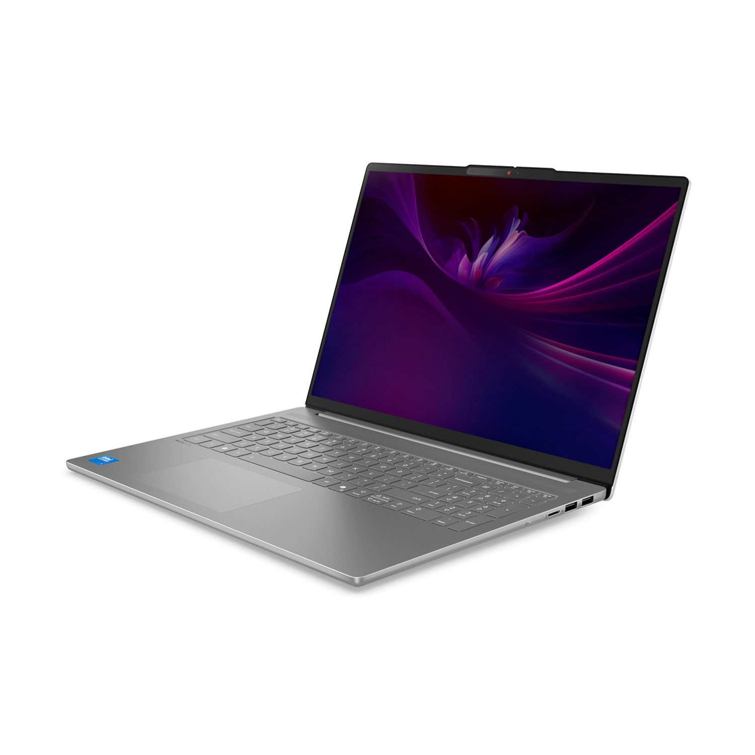 Un laptop argentato è aperto, mostra un design astratto viola e rosa sullo schermo, con tastiera e touchpad visibili.