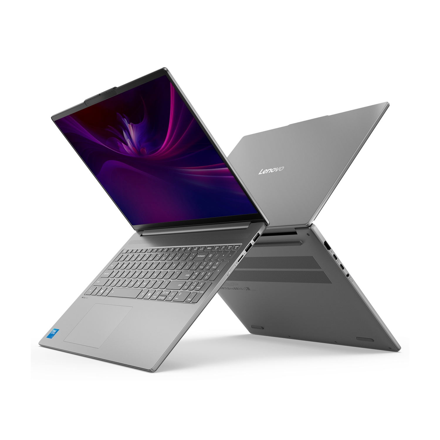 Un laptop Lenovo argentato è aperto, con uno schermo viola. Il laptop è angolato, mostrando tastiera, touchpad e il logo Lenovo.
