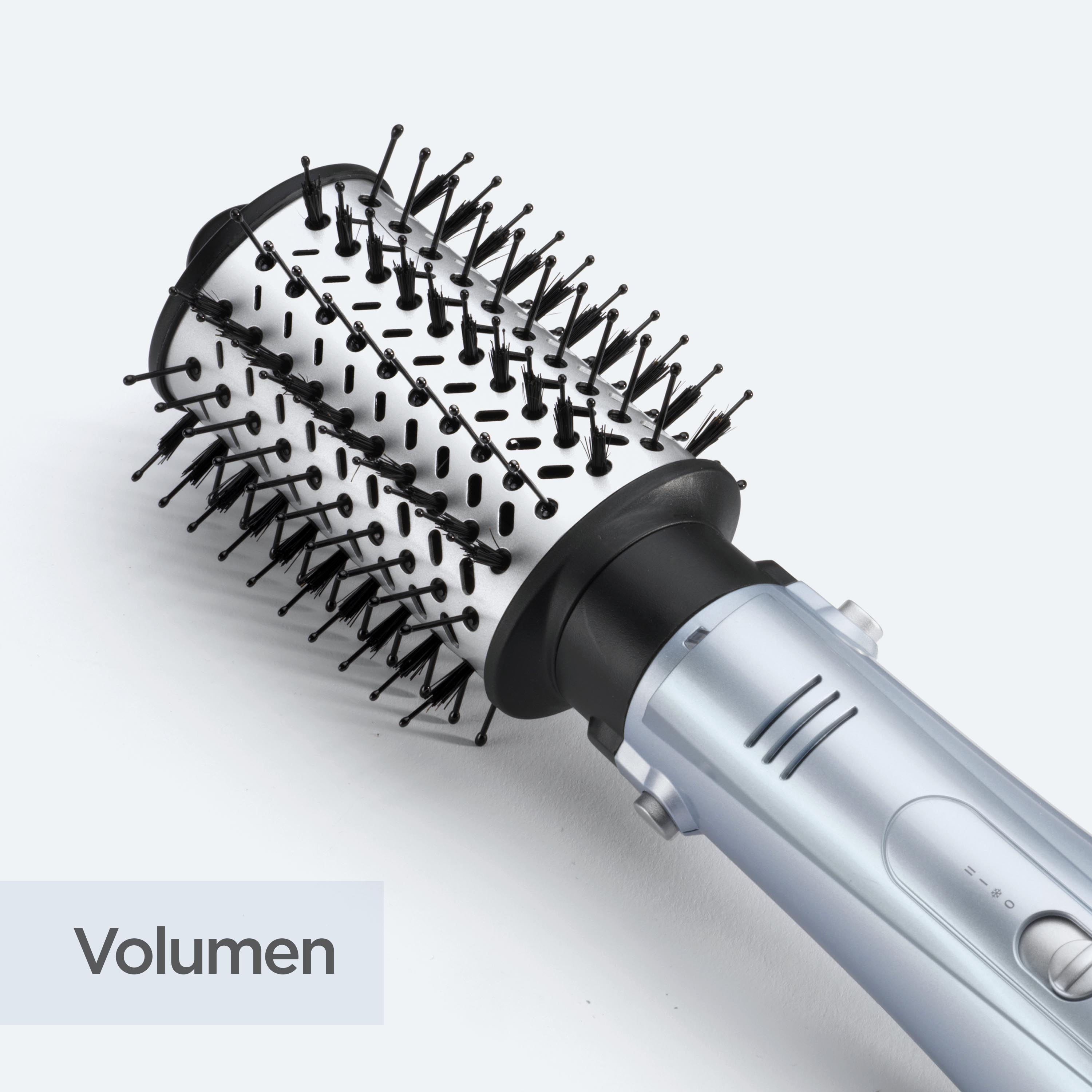 Eine silber-schwarze Haarbürste mit schwarzen Borsten. Die Bürste hat einen Griff mit Bedienelementen. Das Wort 'Volumen' erscheint.