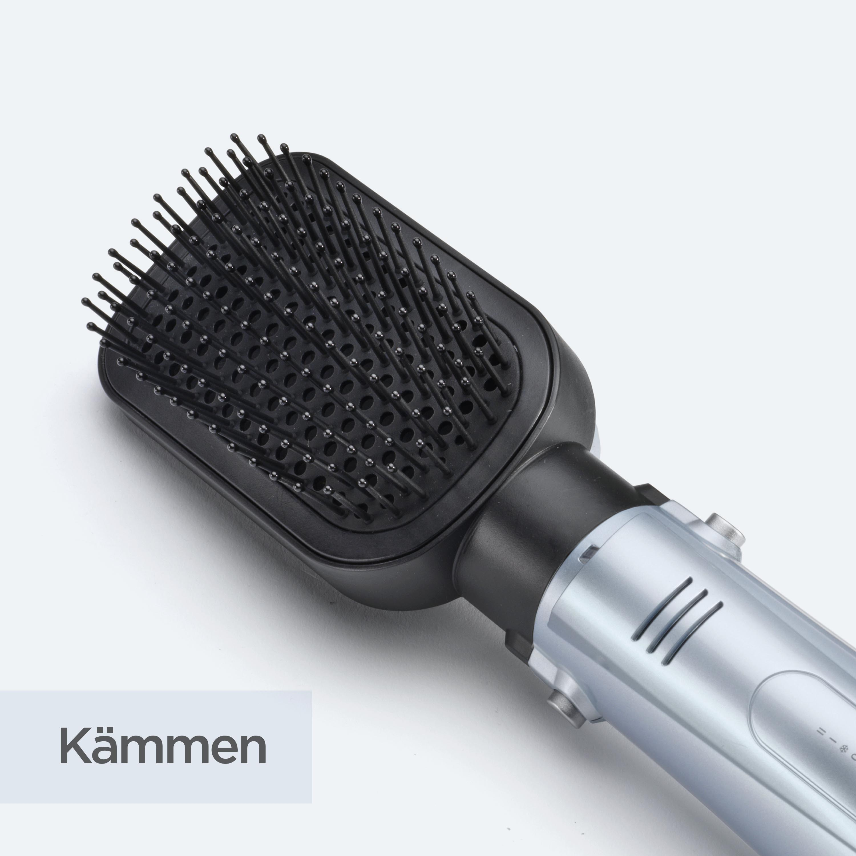 Eine schwarze und silberne Haarbürste. Die Bürste hat schwarze Borsten und der Griff ist silber. Das Wort 'Kämmen' ist vorhanden.