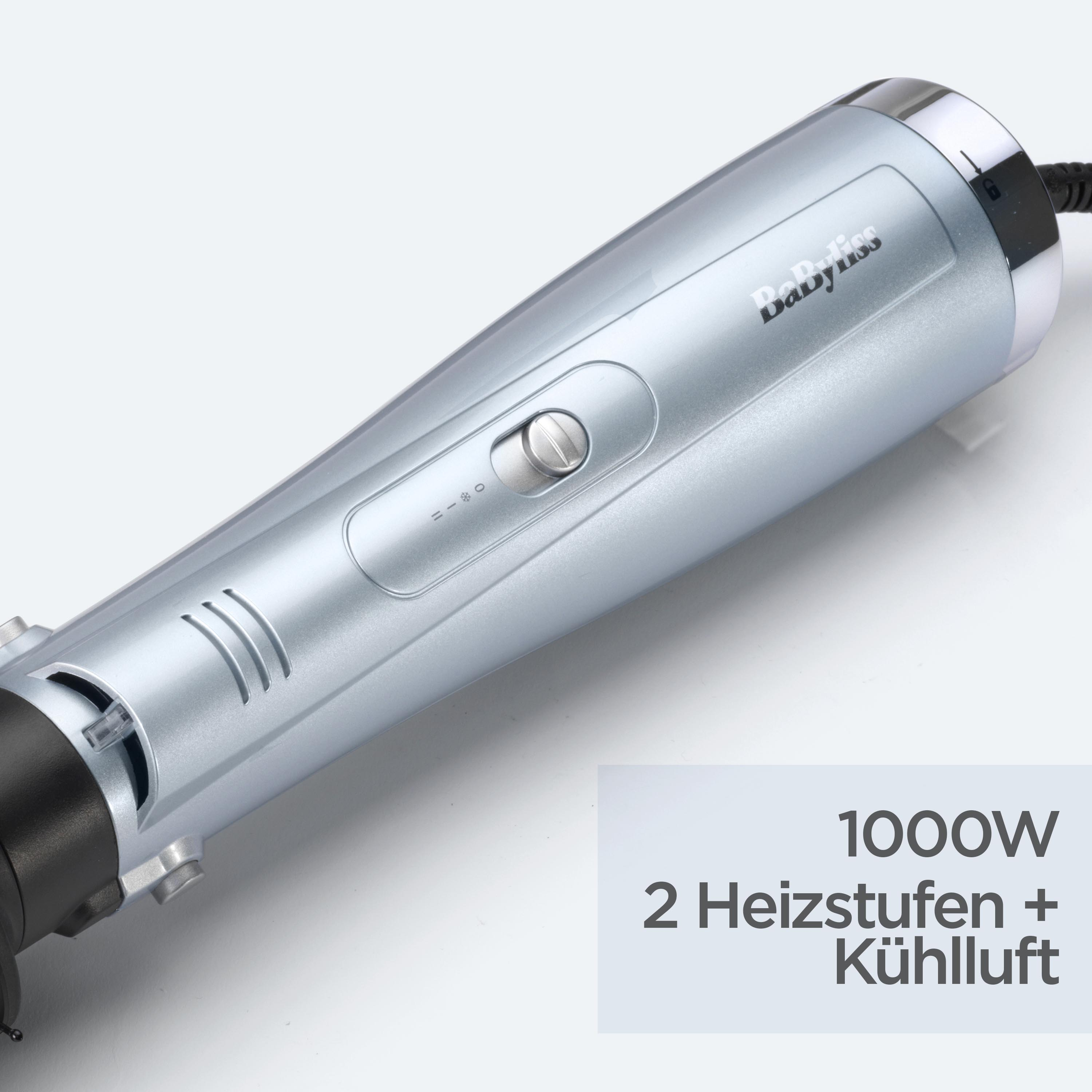 Ein silbernes und schwarzes Babyliss-Haarstyling-Tool. Es hat einen Leistungseinstellknopf. Text: 1000W, 2 Heizstufen + Kühlluft.