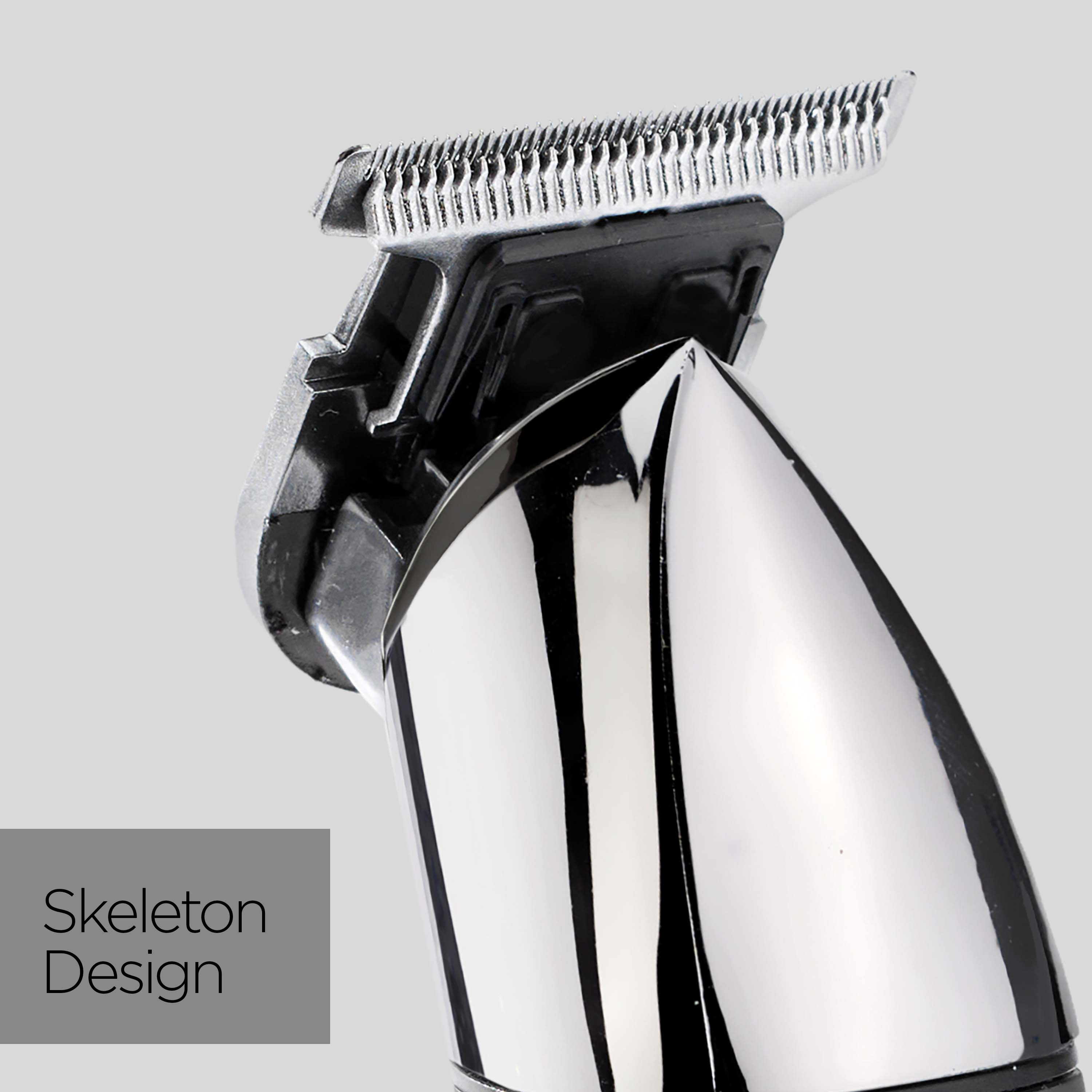 Nahaufnahme eines silber-schwarzen Haarschneiders, beschriftet mit 'Skeleton Design' auf grauem Hintergrund.