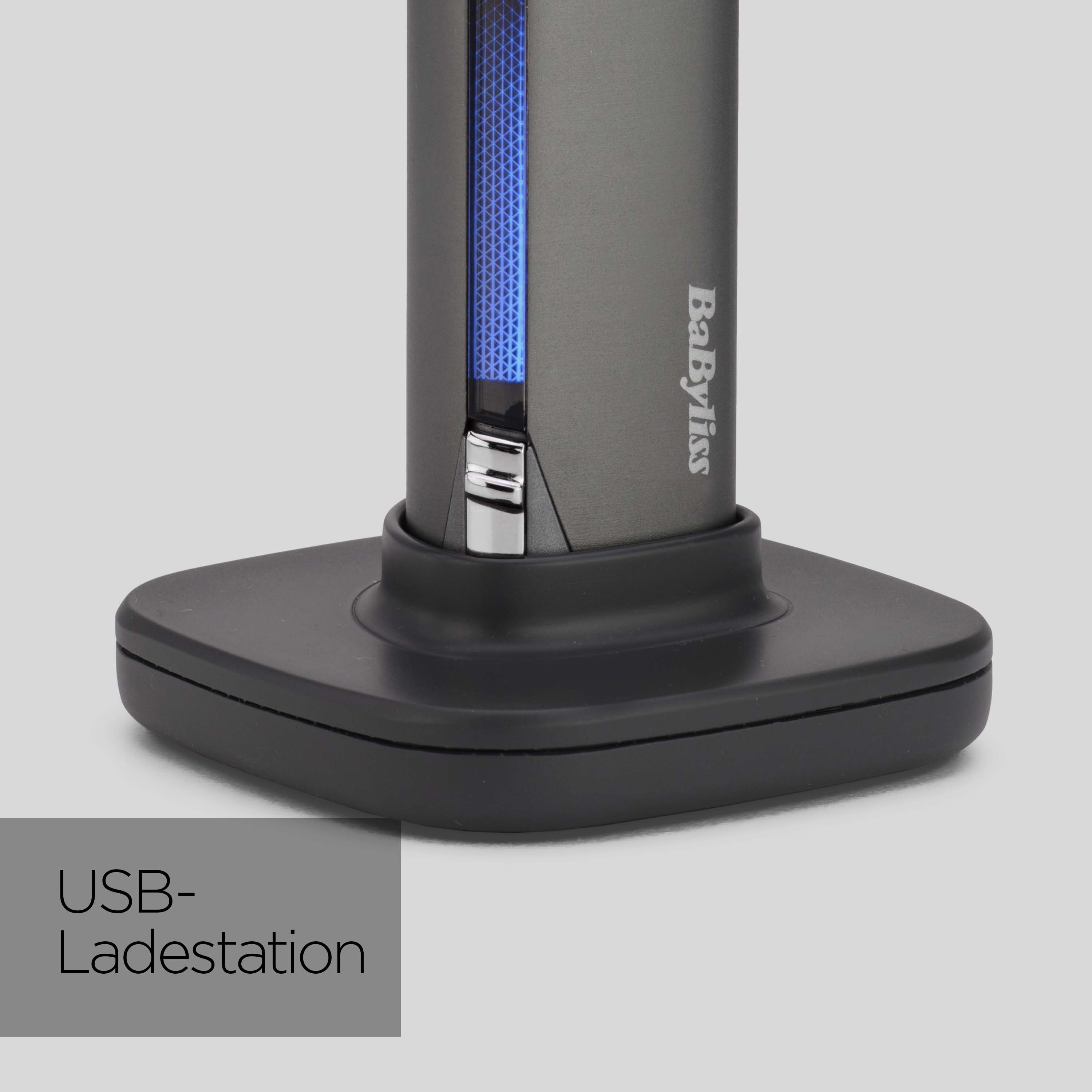 Eine Babyliss USB-Ladestation. Sie ist dunkelgrau mit blauem Licht und schwarzem Sockel. Der Text 'USB-Ladestation' wird angezeigt.