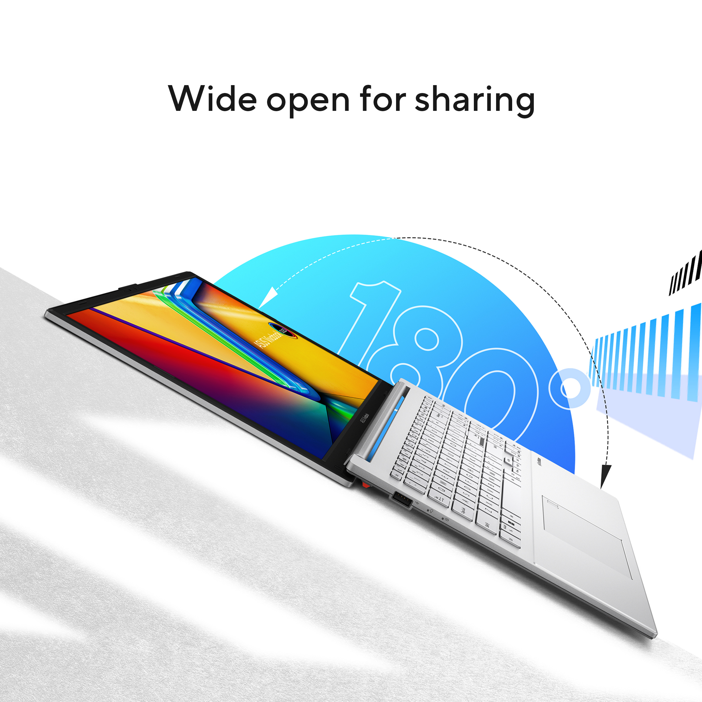 A white laptop is open at 180 degrees. The screen displays color gradients. Text reads 'Wide open for sharing'.