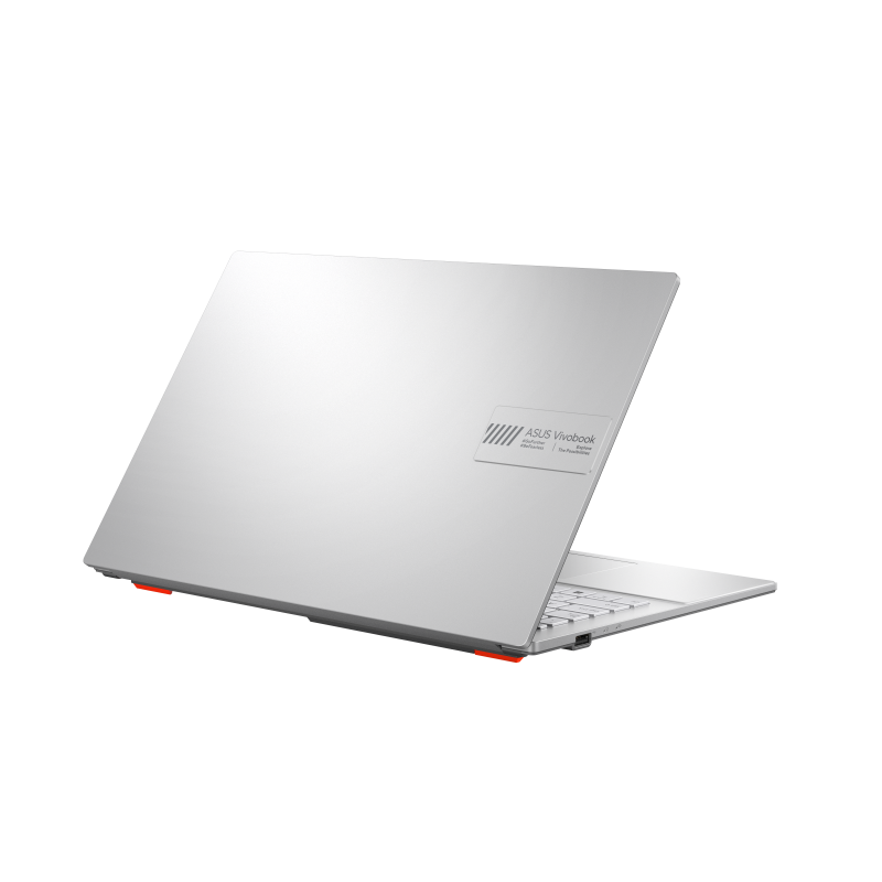 A silver ASUS Vivobook laptop is slightly open, showing the keyboard. Red accents are visible on the bottom. The background is black.