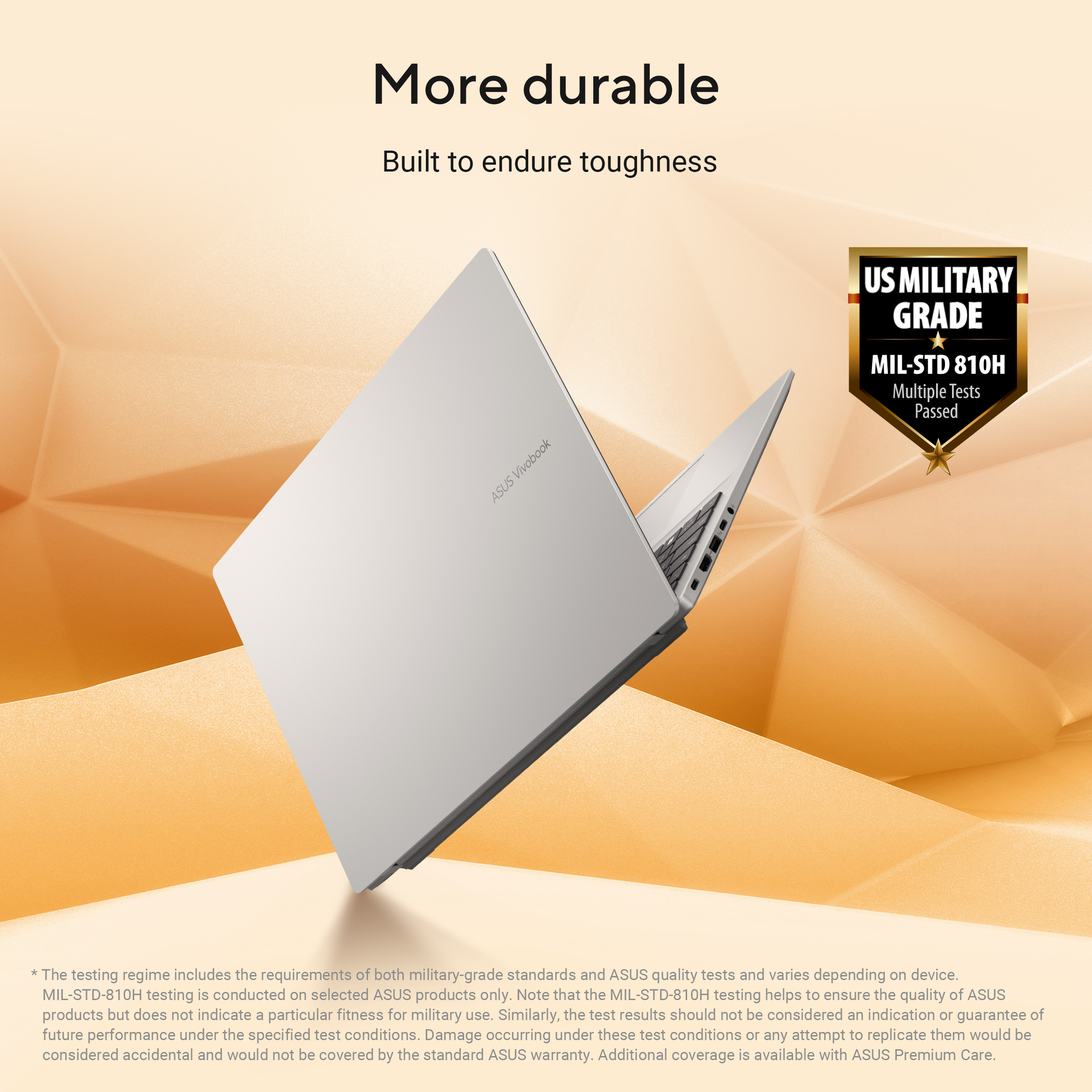 Silver laptop open, on orange textured background. Text: More durable, US Military Grade logo.