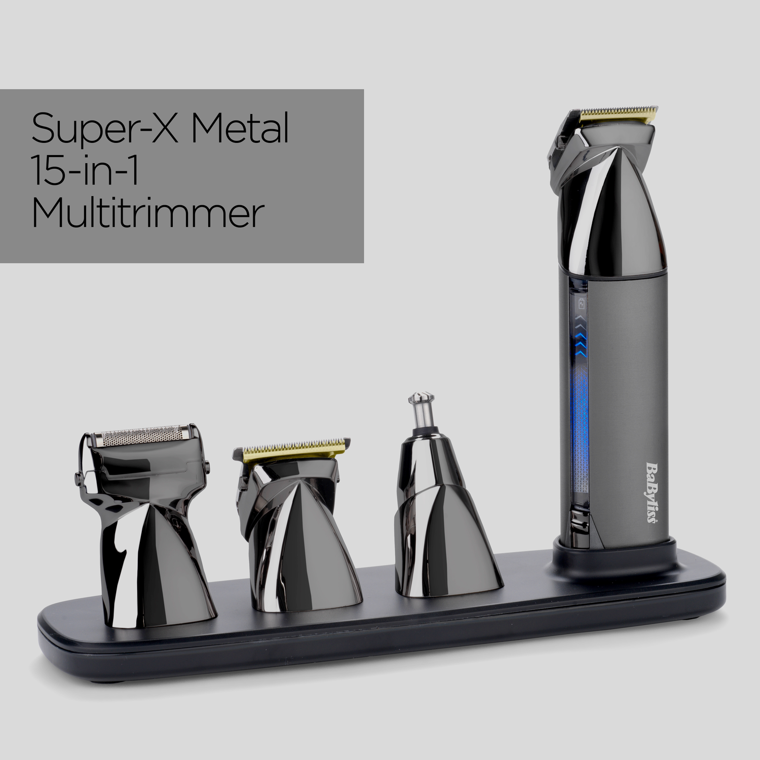 A metallic multi-trimmer set with various attachments. The trimmer is black, with a charging base. The background is light gray.