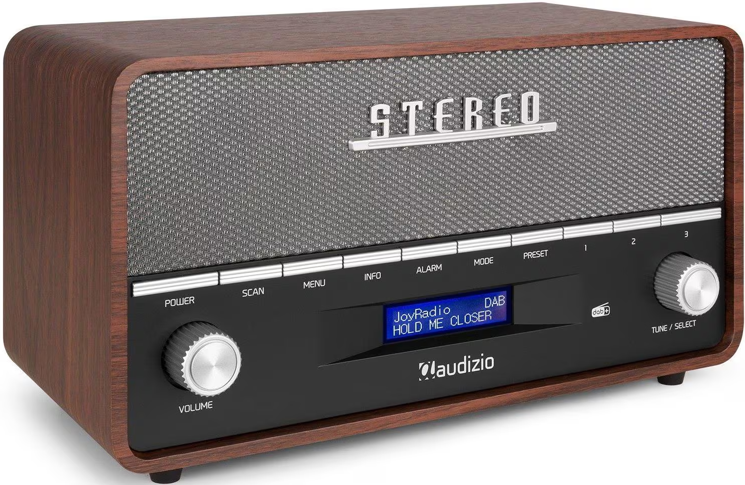 Une radio marron de style rétro avec grille de haut-parleur, écran et boutons de commande. L'écran affiche 'JoyRadio' et 'HOLD ME CLOSER'.